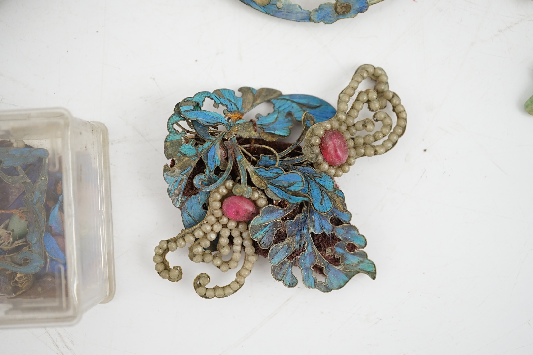A group of eight Chinese kingfisher feather, jade, seed pearl, coral and hardstone mounted headdresses and ornaments, late Qing dynasty, some losses